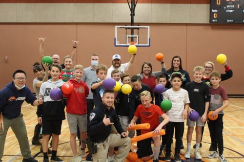 student and staff posing with dodgeballs