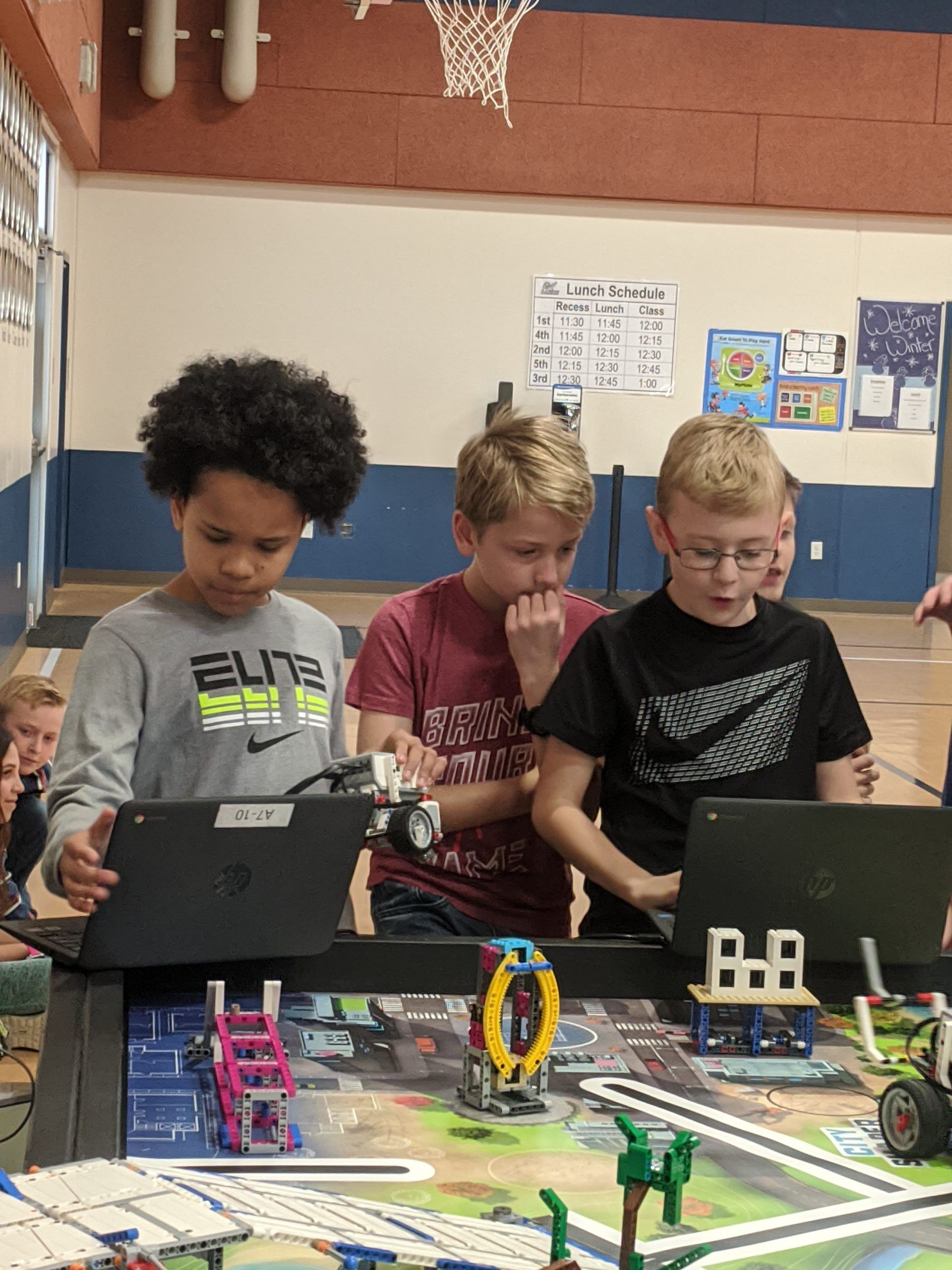 group of students coding Lego robots
